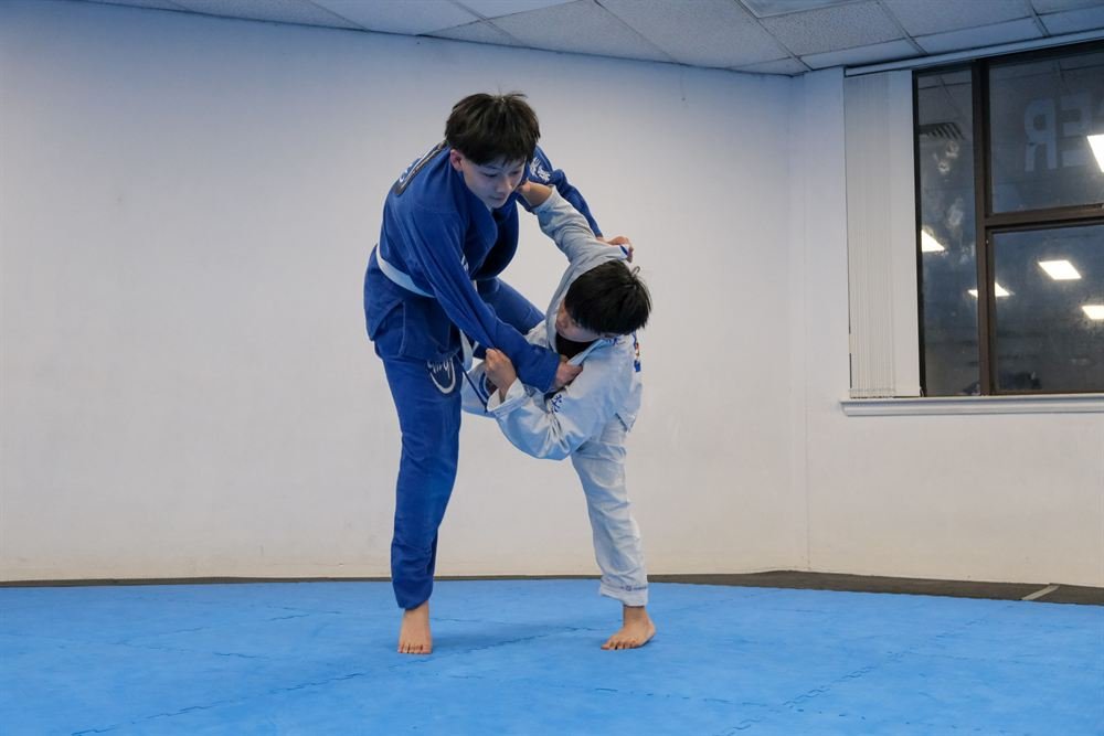 A student executing a throw during training