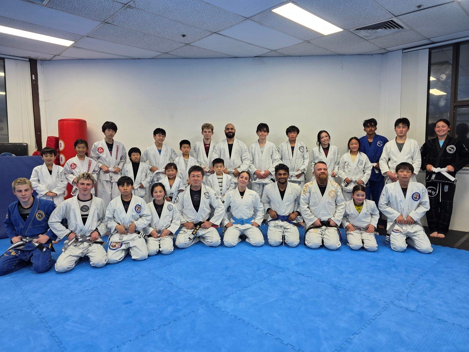 The class lined up along the wall at the start of a gi session